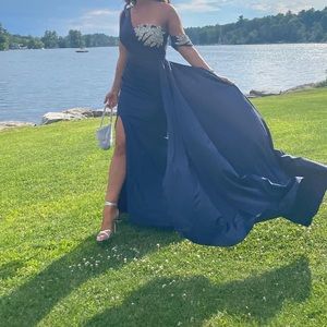 Portia and Scarlet, navy blue one shoulder gown with a slit and rhinestones
